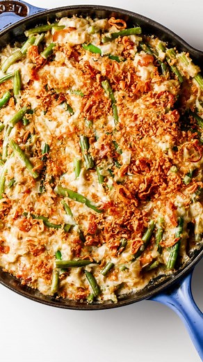 11K views · 19 reactions | These Cheesy Green Beans are made WITHOUT mushroom soup, with a homemade cheese sauce, leeks, onion, and a crispy shallots topping! RECIPE link in bio https://reluctantentertainer.com/cheesy-green-beans/ #greenbeans #cheesygreenbeans #greenbeancasserole | Reluctant Entertainer | Facebook