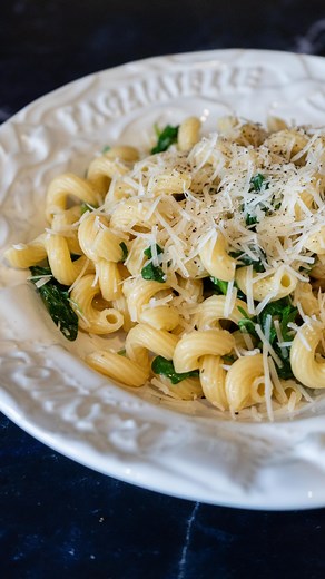 Quick Arugula Pasta 3/4 pound pasta, any shape Olive oil (a few Tablespoons or more) 1-2 cloves garlic, minced 5-8 ounces baby arugula (or spinach) Salt, pepper Fresh lemon juice Parmesan cheese Optional: 1-2 cans tuna OR 1 can white beans OR 1 can clams, drained, liquid reserved Crushed red pepper Cook the pasta in salted water. While it cooks, wash greens. Heat oil in small pan over medium-low heat, and sauté garlic until fragrant. If using crushed red pepper, add it in addition to the garlic.