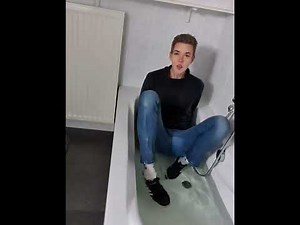 Soaked jeans and Adidas sneakers