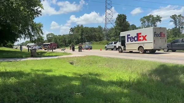 FedEx driver hit by vehicle while delivering package