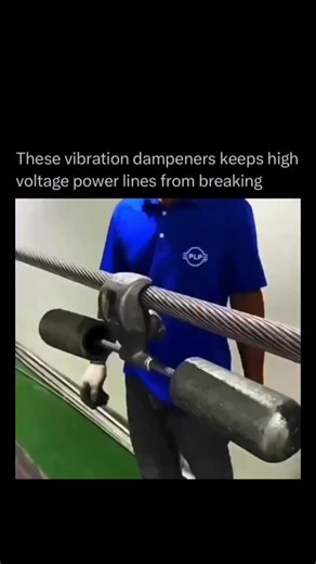 Explaining Everything | Facts | History on Instagram: "Power line vibration dampeners are devices attached to overhead electrical lines to stop them from damaging themselves due to wind-induced motion. When steady winds blow, the wires can vibrate rapidly in a phenomenon called Aeolian vibration, which over time can fatigue and weaken the metal strands. Dampeners—like the familiar Stockbridge type with two weights—work by moving out of sync with the vibrating line and absorbing that energy befor