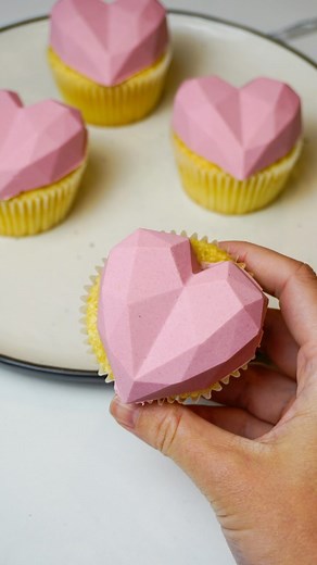 4.6M views · 119K reactions | An easy cupcake decorating hack: melt your buttercream, pour it into a silicone mold (I went with a heart shaped one for Valentine’s Day!) then place a cupcake on it upside down, freeze for about 20 mins, and VOILA! Essentially no skills required for a perfectly shaped buttercream heart cupcake 勺 #cupcakes #valentines #valentinesbaking #valentinescupcakes #buttercream #bakinghacks #bakingtips | Still Busy Baking | Facebook