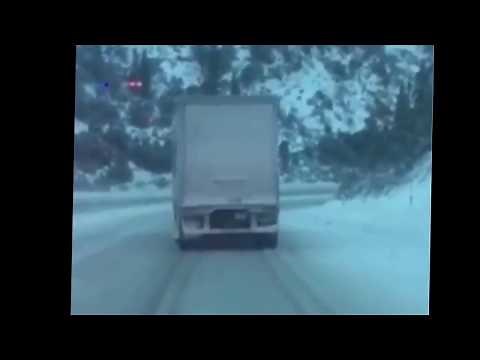 Fedex truck slides down icy interstate I-80 during snowstorm