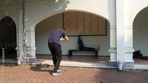 Creative images captured in the shadows of building. Model posing on stool
