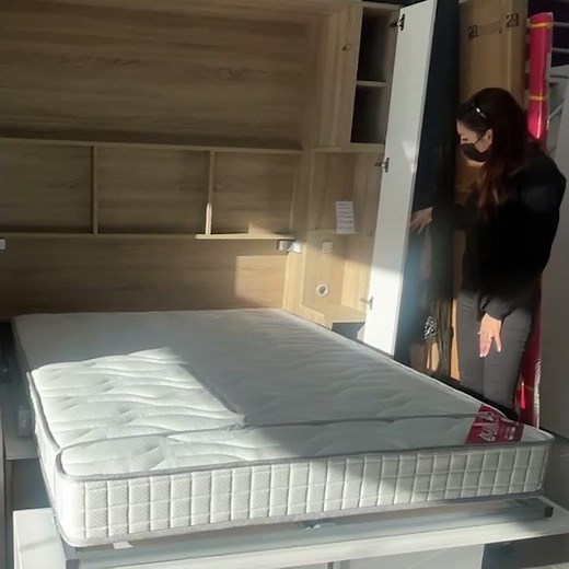 Lit relevable avec canapé coffre.