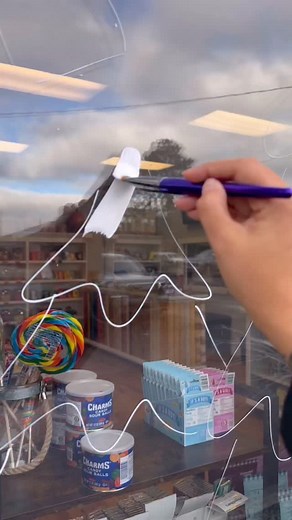 5.3M views · 146K reactions | Yes Halloween is tomorrow but some businesses like to get a good head start on the Christmas windows! I’m not complaining since the weather is still bearable.  First Christmas painting of the year for @popheavenpopcorn! #christmaswindows #windowpainting #windowart #windowartist #christmaswindowdisplay | Lacey Crime Art | Facebook