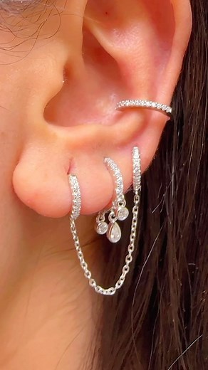 2.2K views · 11 reactions | Double the hoops, double the fun!  These sterling silver CZ hoops linked with a chain and adorned with round and pear stones, paired with a stunning CZ single line earcuff, will elevate any look. ✨ #jewelrygoals #eargamestrong #sterlingsilver #czeverything | IOV jewelry | Facebook