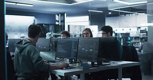 Diverse Software Development Department Working on an Artificial Intelligence Tool and Writing Programming Code. Group of Cyber Security Engineers Integrating a New Cloud Based Service