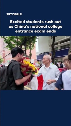 Excited students rush out as China's national college entrance exam ends