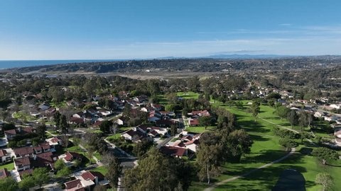clip-4010929285-aerial-drone-video-over-golf-course-house