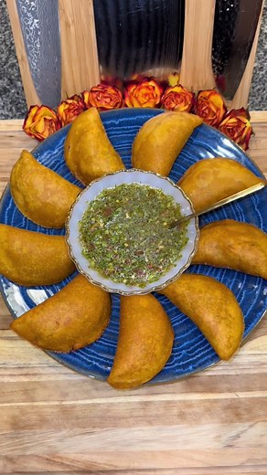 Colombian Empanadas🇨🇴 (stuffed with slow cooked chicken and potatoes) #empanadas #colombian #colombianempanadas #recipes In a slow cooker add: -olive oil -2 medium yellow onions (diced) -1 large tomato (diced) -2 bell peppers (diced) -11 cloves of chopped garlic -12 ounces of beer -season with: Sazon, Adobo, Chicken Bouillon Powder, and Cumin Mix this together. Then get 3 to 4 bone-in chicken breasts and 5 to 8 bone-in chicken thighs and season with the same 4 seasonings as the vegetables (rub