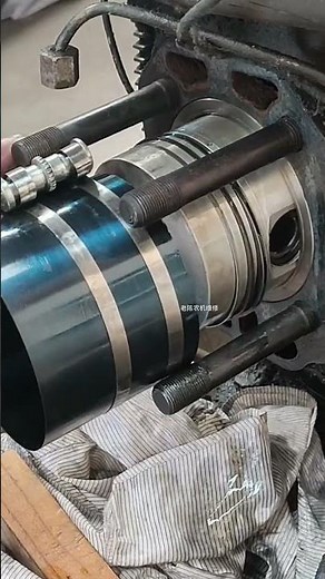 Piston ring compressor tool being used during engine repair #piston #repair #tools #shortsfeed