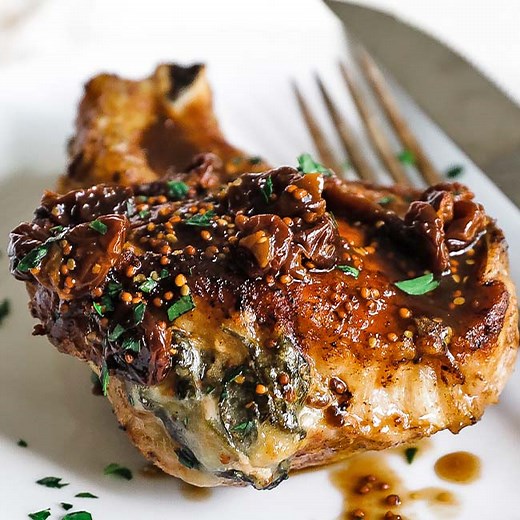 #ad These Stuffed Thick Cut Bone-In Pork Chops with @usacherries, Spinach, Fontina, and Sourdough, is the perfect dish to impress with. The tart cherries take this recipe over the top! Recipe at https://bit.ly/36vhFs3 | Chef Billy Parisi