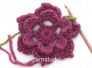 In this video we show how to work the Wild rose used in our Mystery Blanket. Have you joined the CAL? It is not too late, read more here: http://www.garnstudio.com/lesson.php?id=40&cid=19#schedule To see an easy step by step explanation to this video, go to: www.garnstudio.com/lesson.php?id=50&cid=19 To see the video how to work the square, go to: http://www.garnstudio.com/lang/en/video.php?id=964 There are more than 950 DROPS Video tutorials, to get a complete overview go to: http://www.garnstu