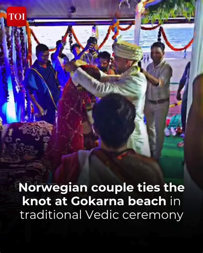 Dressed in traditional Indian attire, Norwegian couple Sam and Artima married the Vedic way in a serene beachside ceremony at Gokarna — complete with mandap, mantras, and blessings from the local community. #Karnataka #Gokarnabeach #NorwegianCouple #gokarnawedding #viralvideo | The Times of India