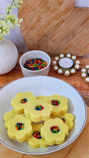 BURFEE Our Deepavali box always consists of burfee. It's my favourite sweet meat and I absolutely love making them. You will need: 1 cup fresh cream 1/2 tin condensed milk 2 tbsp ghee 2 1/2 cups milk powder 1/2 tsp elachi powder To decorate: Coloured almonds ~On medium high heat, add in your fresh cream, condensed milk, and ghee. Mix well. ~Once the mixture begins to bubble, add in your milk powder and whisk to form a smooth and creamy mixture. ~Whisk your mixture for 2-3 minutes and then remove