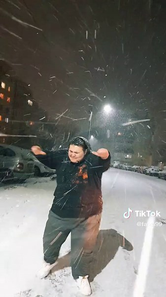 Captivating Nighttime Snowfall Dance Performance