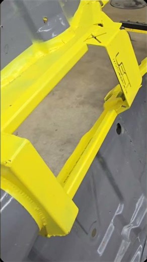 Complete chassis setup with stiffening components, transmission tunnel, and spring relocation.