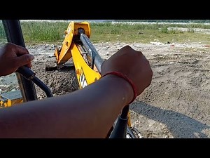 Skillful Operator-INSIDE the CABIN-Operating JCB Backhoe