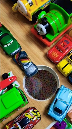 Tow Mater pushing Max Schnell, Flo, Jeff Gorvette and Lightning McQueen in pit, pixar cars review 68