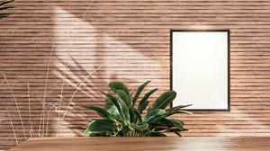 Wood table background with sunlight window create leaf shadow on wall with blur indoor green plant foreground. mockup for photo frame with wooden wall background, 3D animation rendering