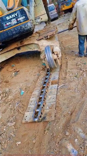 Heavy machinery track repair, on-site practical demonstration
