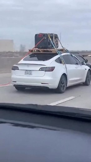 Tesla road trip hack: charging with a roof generator — everyone’s shocked! This guy took a road trip in his Tesla, but just in case, strapped a generator to the roof and charged his EV while driving. Other drivers are speechless: is this next-level genius or total madness? The internet can’t believe it! #wow #ai #fail #really #tesla #car #generator #roadtrip #lifehack #viralclip #crazyidea #car #travel #no #funny #no #what #haha | The.worldai