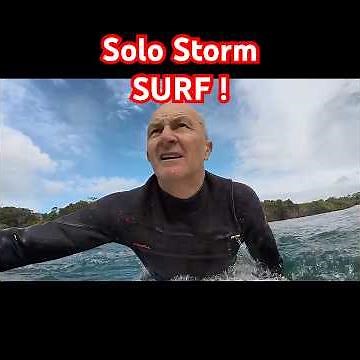 SURFING ALONE in stormy seas in 4k