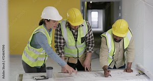 Construction, team collaboration and blueprint for architecture, building proposal or development logistics. Group, engineering or floor plan for industrial design, maintenance or property management