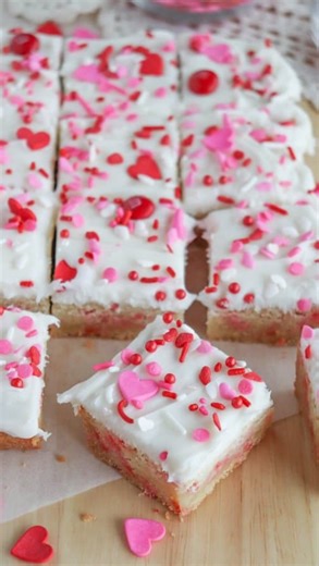 Valentine’s Day Sugar Cookie Bars ✨ These are soft, chewy and topped with fluffy white frosting and festive sprinkles. 💕💖 Perfect for parties, school treats, or a little snack when you’re craving something sweet. 💗 Comment “recipe” and I’ll send you the details or find them here https://homemadeheather.com/valentine-sugar-cookie-bar-recipe/ Ingredients: * 1 cup white granulated sugar * ½ cup butter room temperature * 2 large eggs * 1 tsp vanilla extract * 2 cups all purpose flour * 1 tsp baki