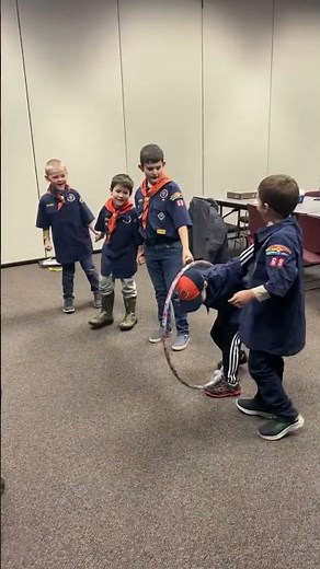 The Cub Scout pack Tiger Scouts have fun playing a challenging game.