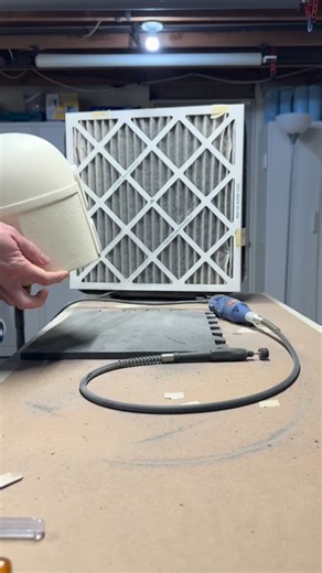 Rewinding a step back from my last reel, here’s a look at some of the work involved in prepping raw urethane resin casts for painting and turning into proper Mandalorian helmets! It’s a dirty job, this video doesn’t do justice to how much dust this process kicks up. I always start with at the bottom opening and use a rotary tool with a sanding drum to clean up the excess resin. Then I trim the visor area with a body shop saw and sand the inside edges flush with a finger sander. It’s not shown he