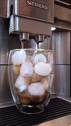 Espresso over ice cubes and milk