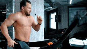Bodybuilder running on a treadmill  - Free Stock Video