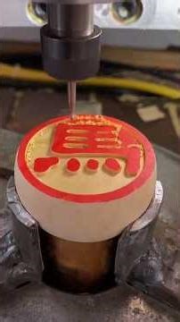 CNC engraving machine engraves characters on Chinese chess pieces