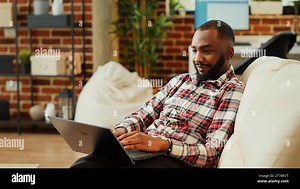 Work from home employee remotely solving tasks while in video conference meeting with boss. Teleworker inputing data on laptop keyboard in online video call under manager guidance Stock Photo - Alamy
