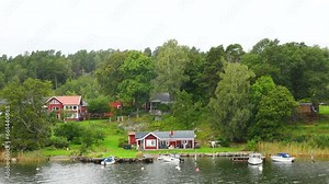Cottages on the shore. Sweden. Amazing Swedish Wooden Log Cabin House On Rocky Island. Beautiful homes and vacation cottages on the tiny islands of the Stockholm Archipelago.