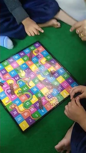 Learning maths with Snake and Ladders game by Kids at Prema's School Jodhpur