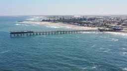 Namibia Swakopmund Beach and Jetty. 4K Drone Video towards the iconic...