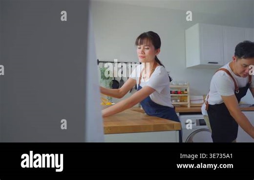 Woman cleaning kitchen counter with cloth Stock Video Footage - Alamy
