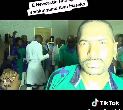 Group Dance Performance in Uniform at Indoor Event