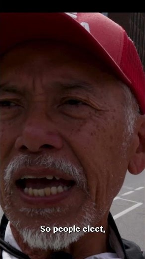 The “Upside Down Sign Guy” Speaks | Wellington Street Protester