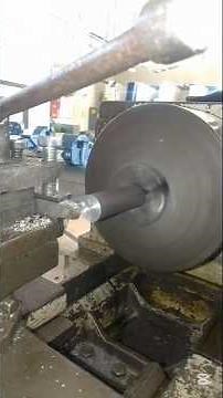 The process of performing facing and turning operations on a lathe machine.