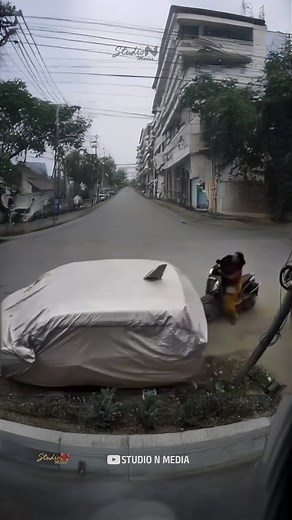 2.8M views · 7.7K reactions | ചേച്ചി മാസ്സ് Powerful People comes from Powerful Places 掠 The power Scooty rider Woman hits scooter to a parked car, which caused the car to move forward, showing the power and indicating how careful you should be. #automobile #studionmedia #scooter #traffic #shorts #funny #cctv | Studio N Media | Facebook