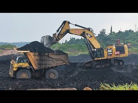 Caterpillar 6015B Excavator Loading Coal to Haul Truck Coal