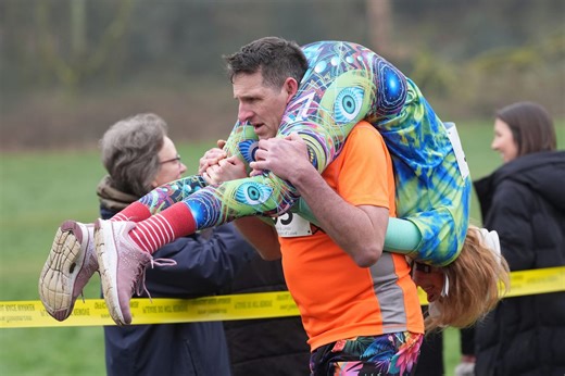 Couples go extra mile in eccentric UK wife carrying race