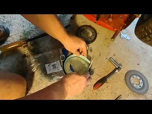 Snapper riding mower won't go forward uphill, will not drive, slips. Remove & replace drive wheel.