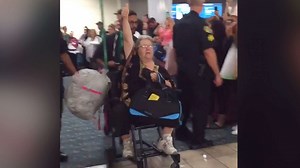 Woman removed from plane after boarding with 'emotional support' squirrel