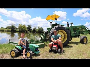Using real tractors and toy tractors to mow grass and play in mud | Tractors for kids