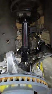 Installing the new strut in the 2015 Ford Edge Sport. The bolts are a different system